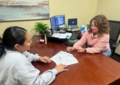 A lender at Central State Bank in Iowa discusses a loan with a customer.
Window title: Car Loans in Iowa